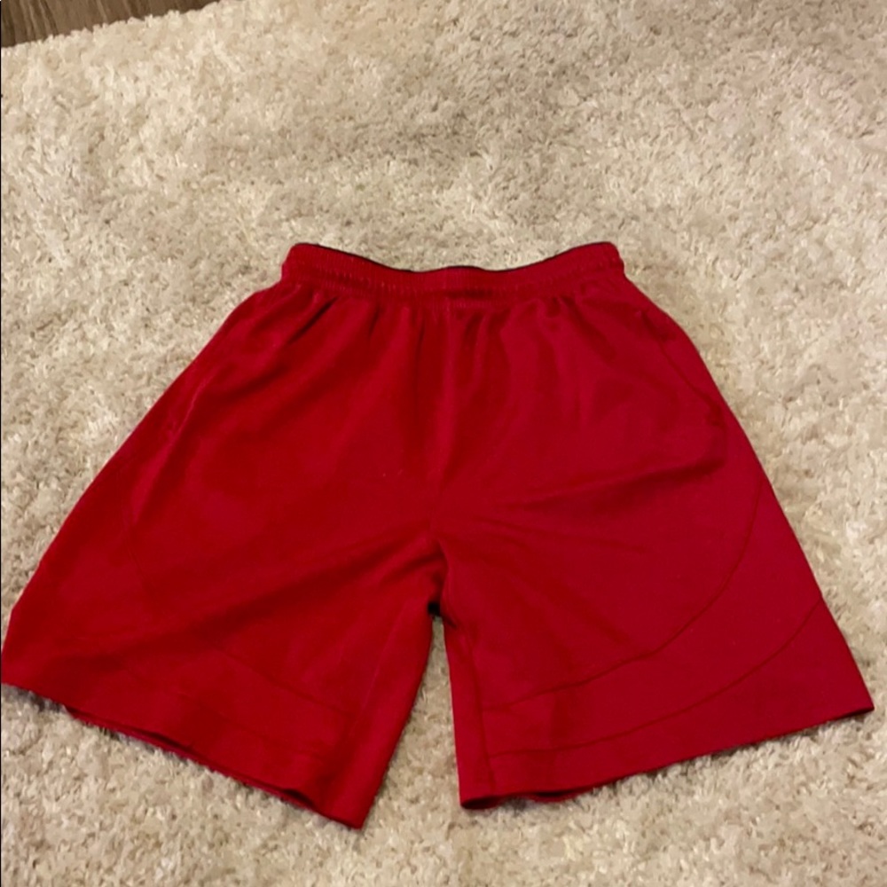Men’s red athletic shorts.